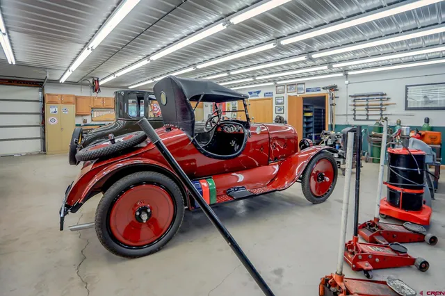 a utility room with furniture and clutter