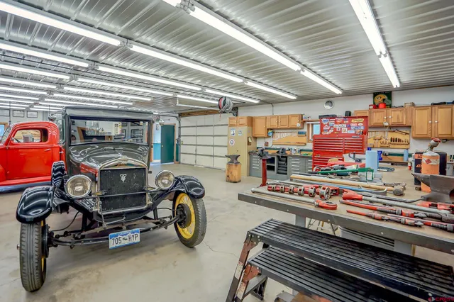 a living room with lots of furniture and a chandelier