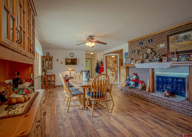 a view of a dining room with furniture and chandelier