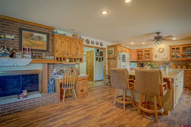 a dining room with furniture and wooden floor