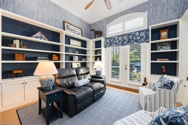 a living room with furniture cabinets and book shelf