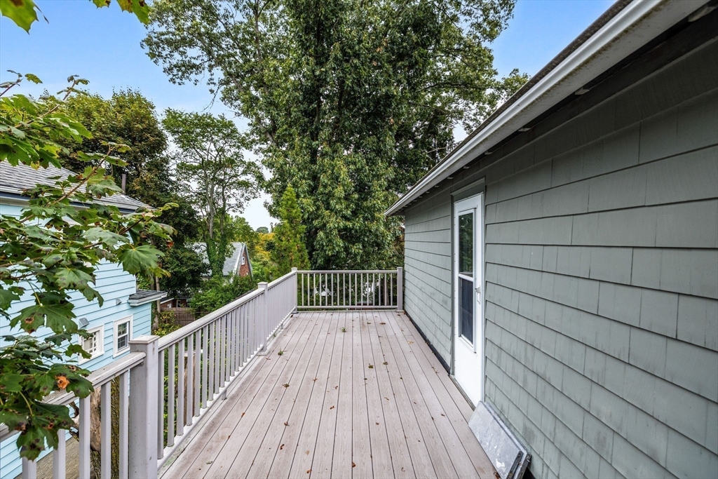 29 Undine Road Boston, MA 02135 - Photo 11 of 16 a view of balcony with wooden floor and fence