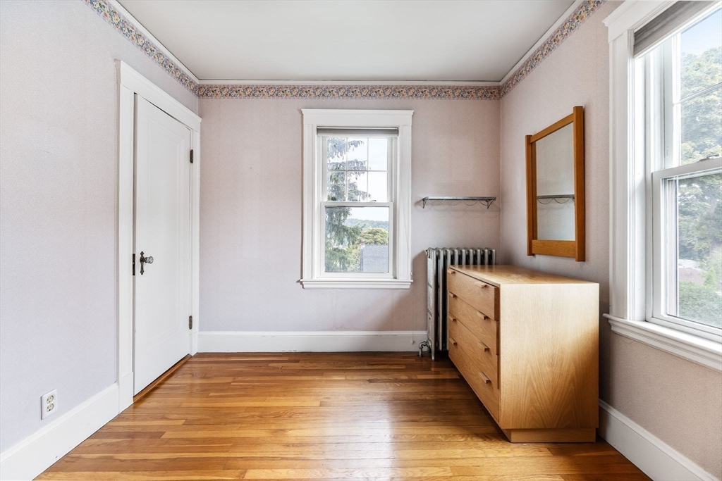 29 Undine Road Boston, MA 02135 - Photo 9 of 16 a view of empty room with wooden floor and fan
