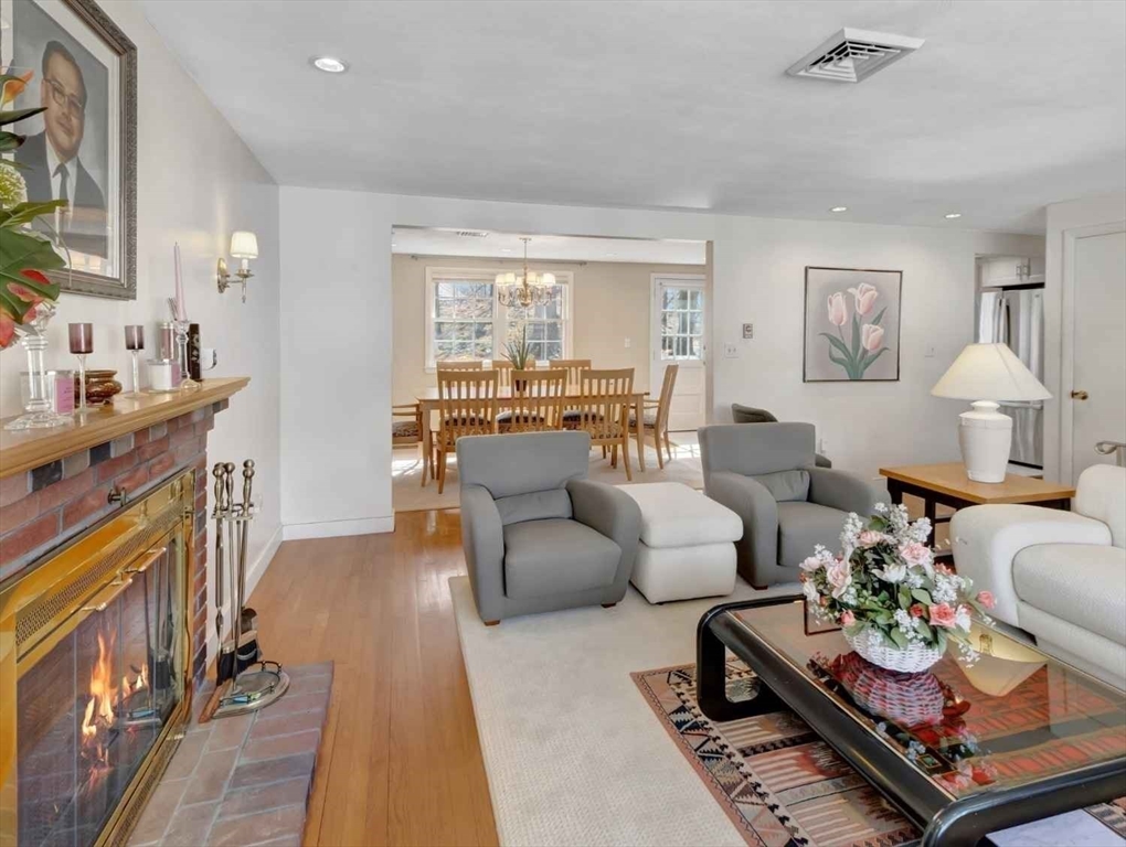 22 Susan Drive Saugus, MA 01906 - Photo 11 of 42 a living room with furniture fireplace and a window