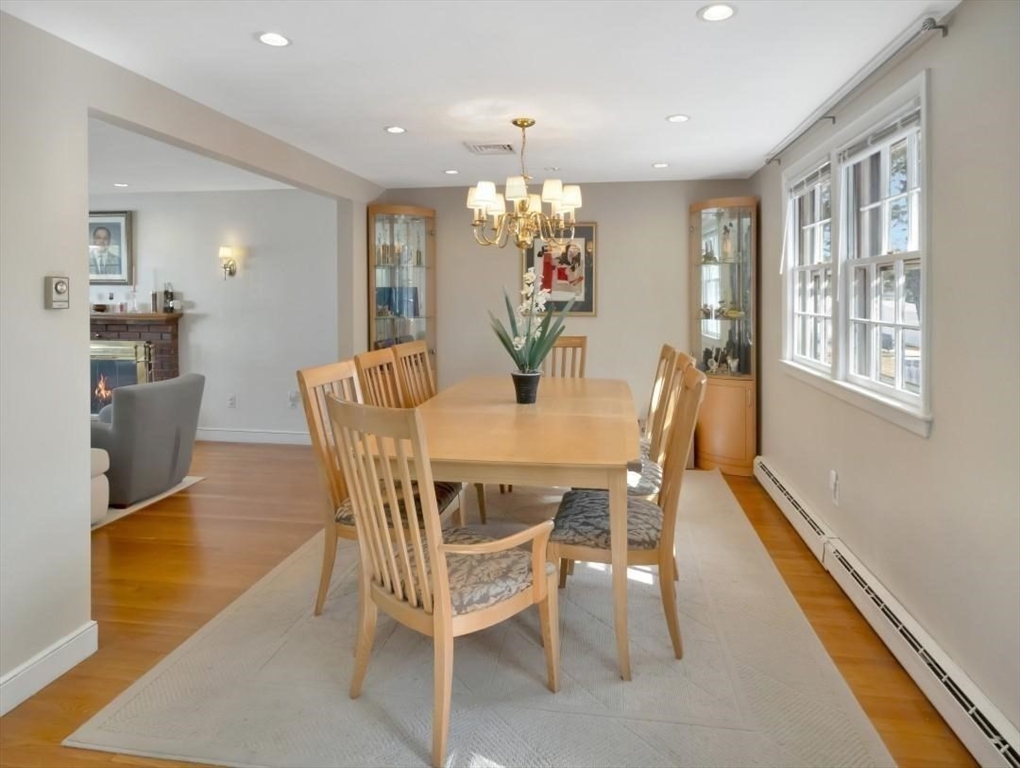 22 Susan Drive Saugus, MA 01906 - Photo 14 of 42 a dining room with furniture a chandelier and wooden floor