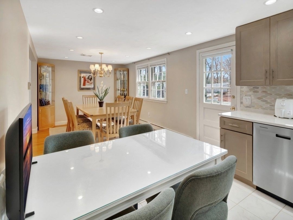 22 Susan Drive Saugus, MA 01906 - Photo 16 of 42 a living room with stainless steel appliances furniture a dining table and kitchen view
