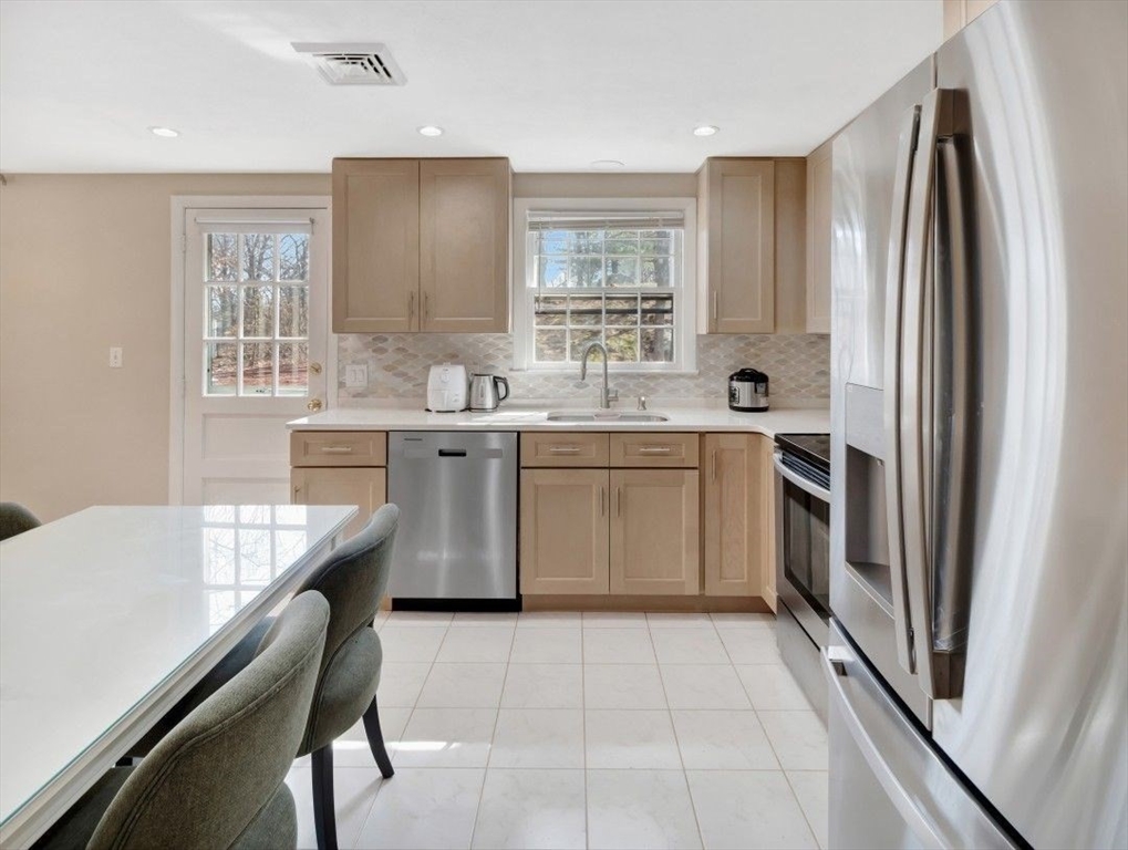 22 Susan Drive Saugus, MA 01906 - Photo 18 of 42 a kitchen with a sink appliances and cabinets