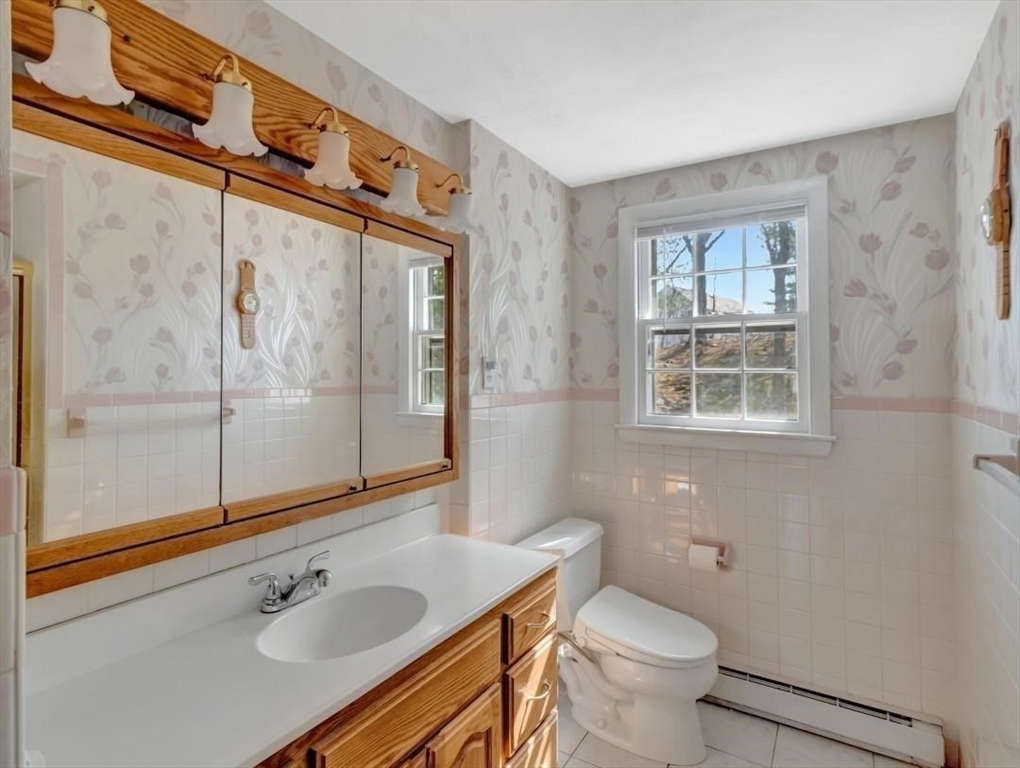 22 Susan Drive Saugus, MA 01906 - Photo 21 of 42 a bathroom with a sink toilet and shower