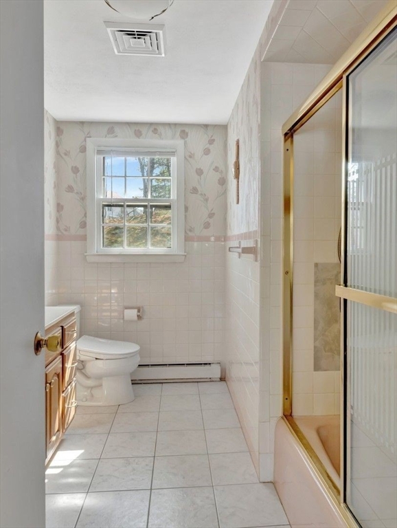 22 Susan Drive Saugus, MA 01906 - Photo 22 of 42 a bathroom with a toilet a sink and shower
