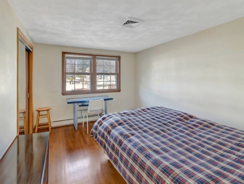 22 Susan Drive Saugus, MA 01906 - Photo 28 of 42 a bedroom with a bed a table and chair