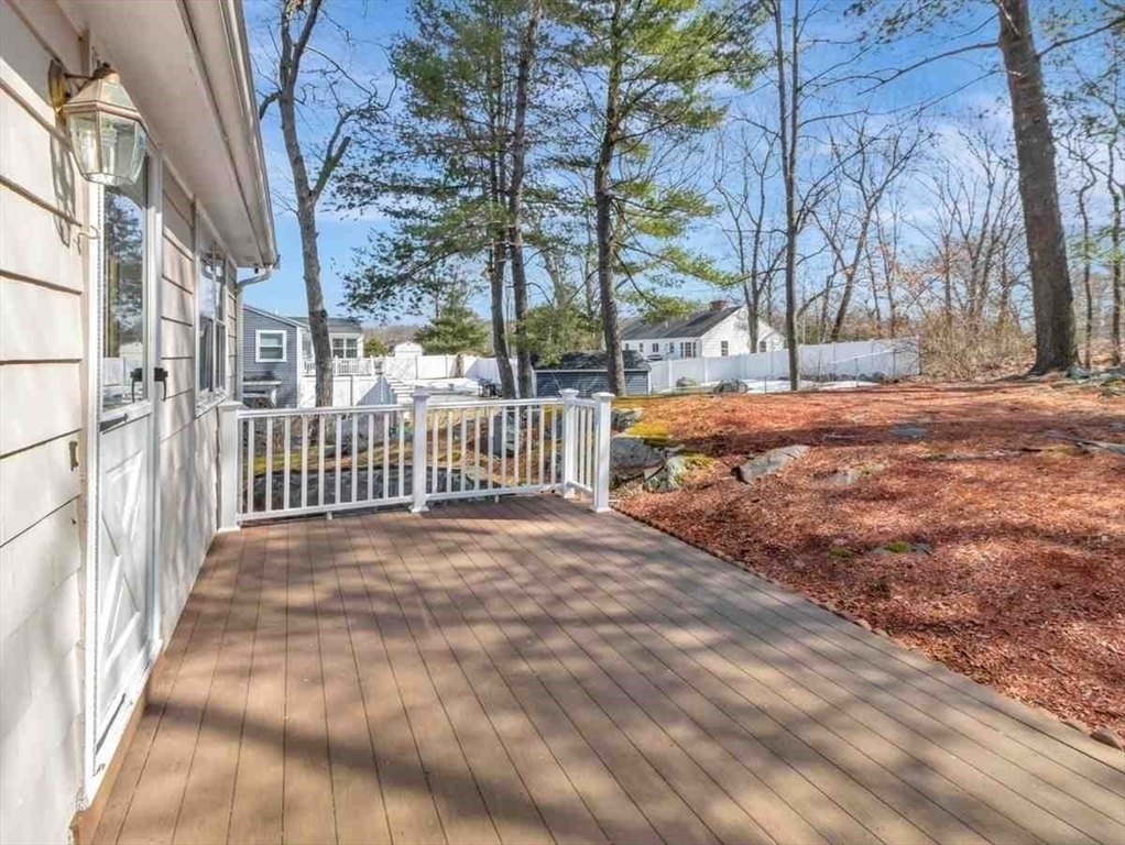 22 Susan Drive Saugus, MA 01906 - Photo 34 of 42 a view of backyard of white apartments with large trees