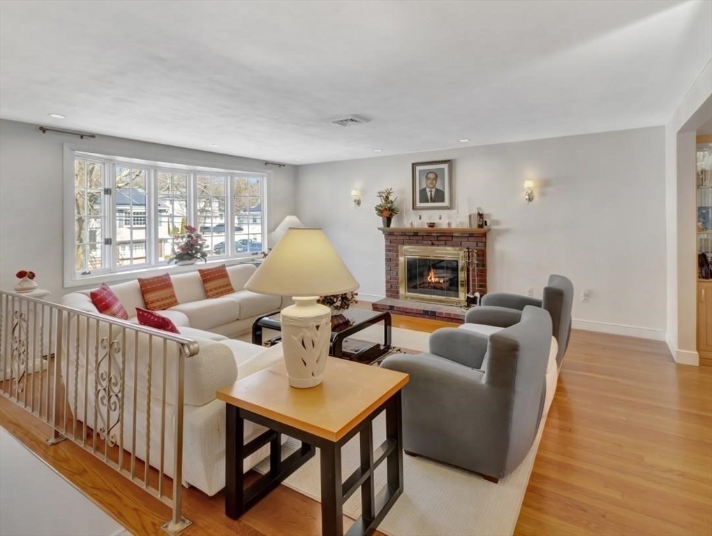 22 Susan Drive Saugus, MA 01906 - Photo 7 of 42 a living room with furniture fireplace and a table