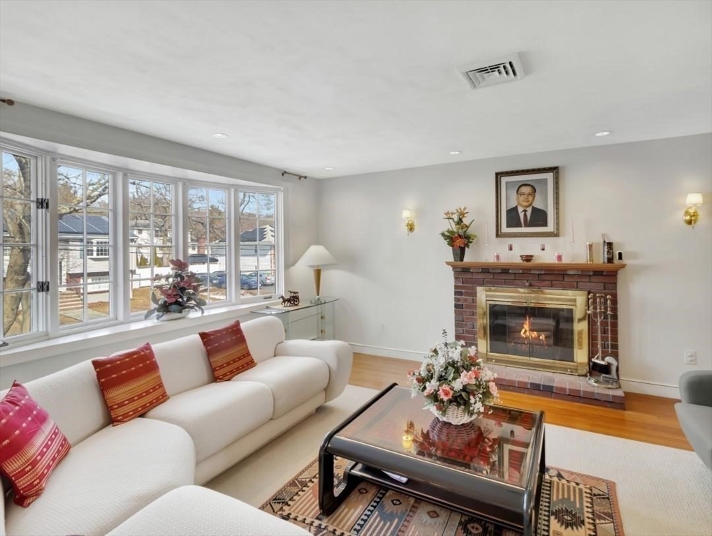 22 Susan Drive Saugus, MA 01906 - Photo 10 of 42 a living room with furniture a fireplace and a large window