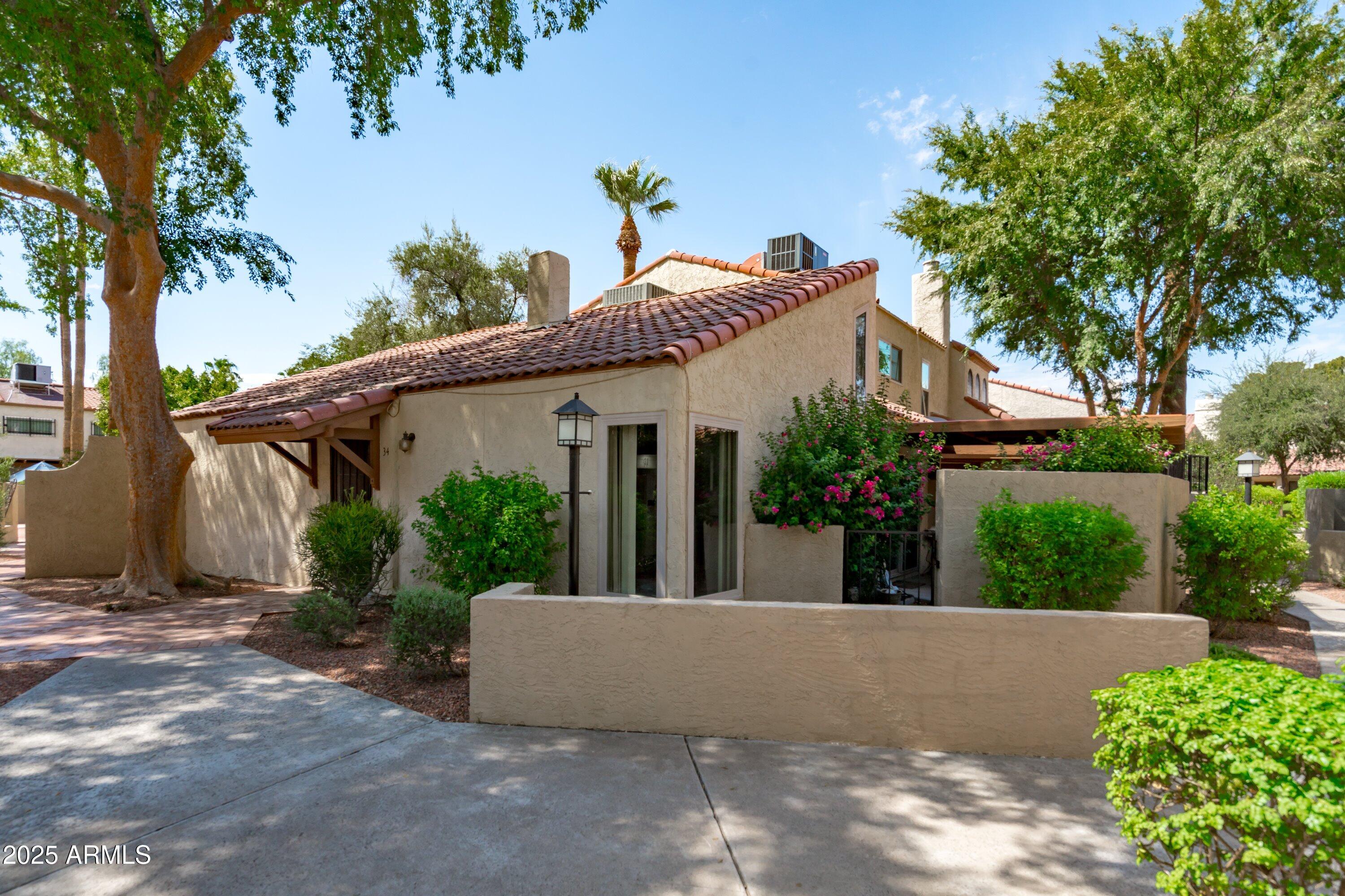 6533 North 7th Avenue, Unit 34 Phoenix, AZ 85013 - Photo 1 of 32 front view of a house with a street