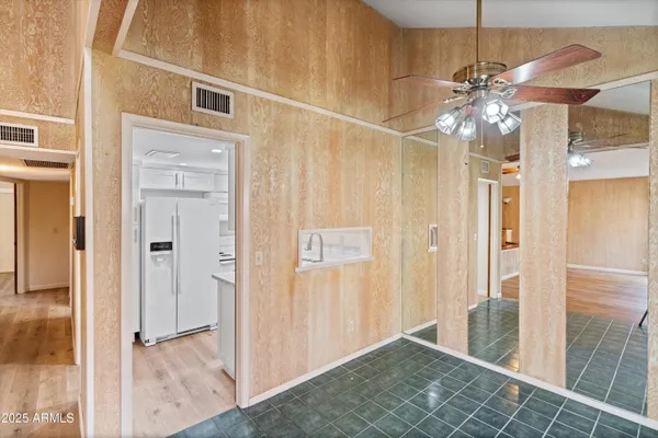 a utility room with cabinets washer and dryer