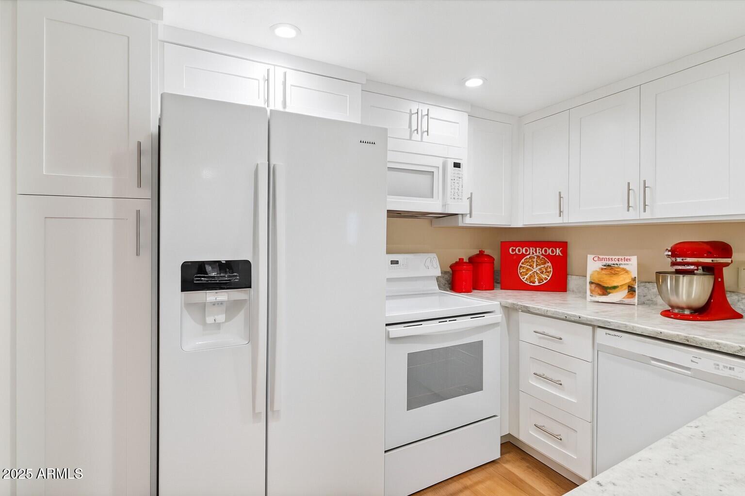 6533 North 7th Avenue, Unit 34 Phoenix, AZ 85013 - Photo 14 of 32 a utility room with cabinets washer and dryer