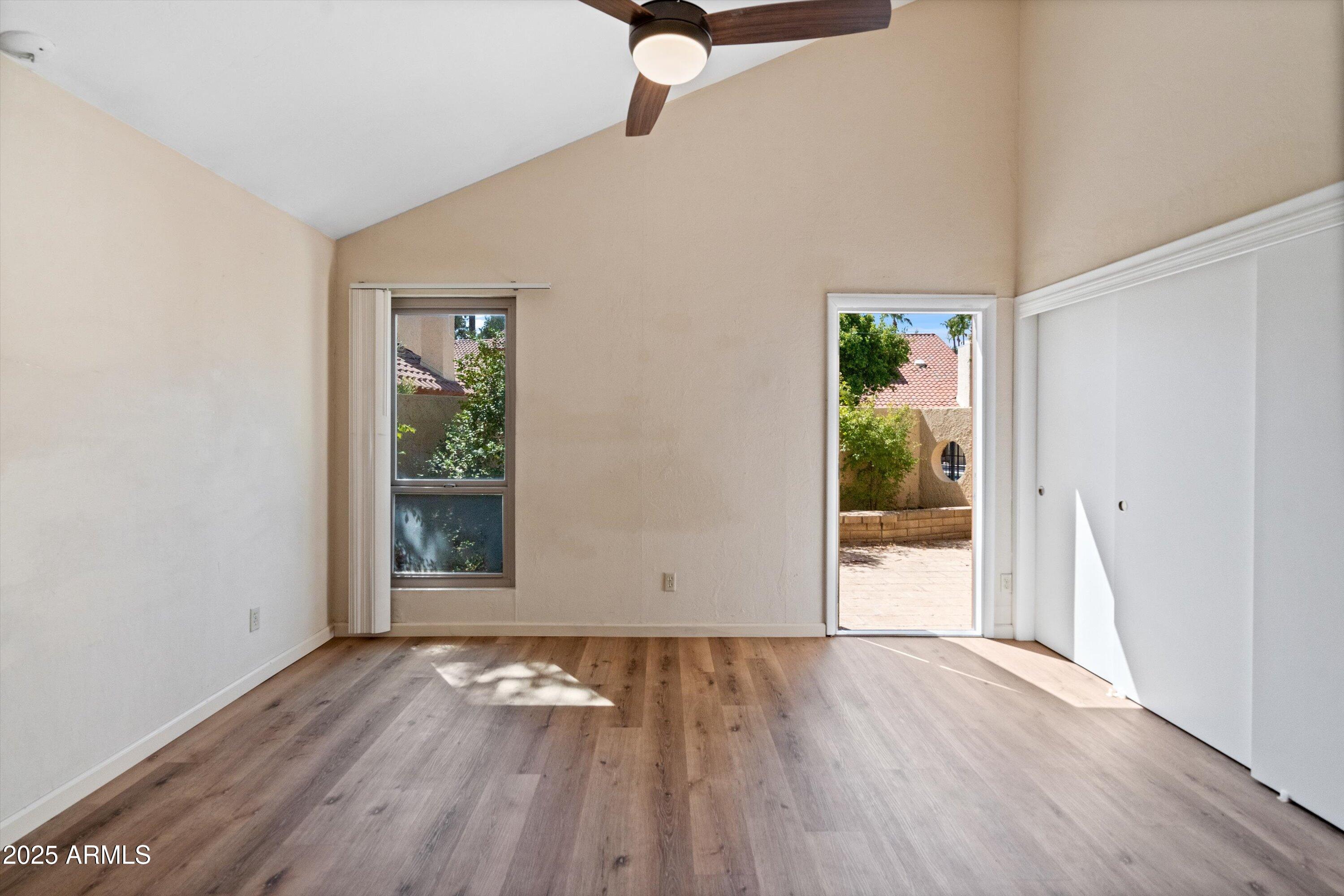 6533 North 7th Avenue, Unit 34 Phoenix, AZ 85013 - Photo 19 of 32 wooden floor in an empty room with a window