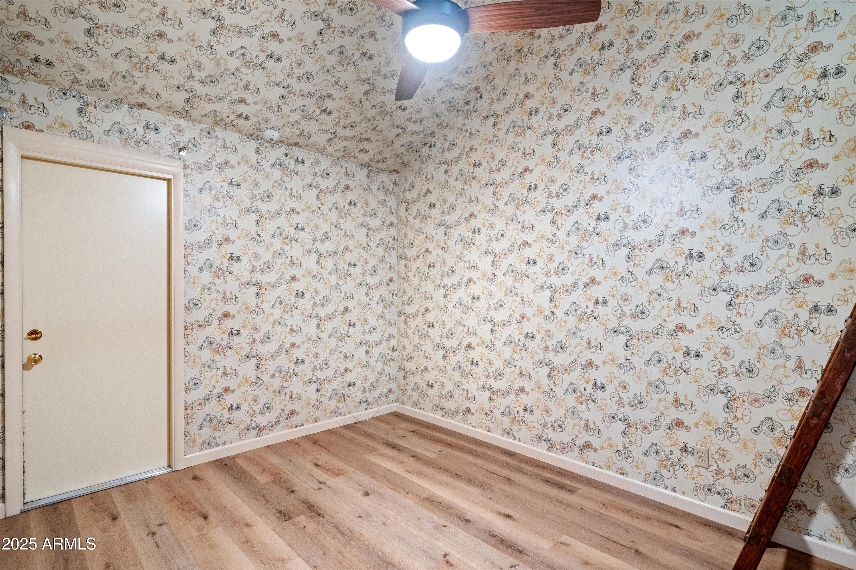 6533 North 7th Avenue, Unit 34 Phoenix, AZ 85013 - Photo 23 of 32 a view of wooden floor and white walls