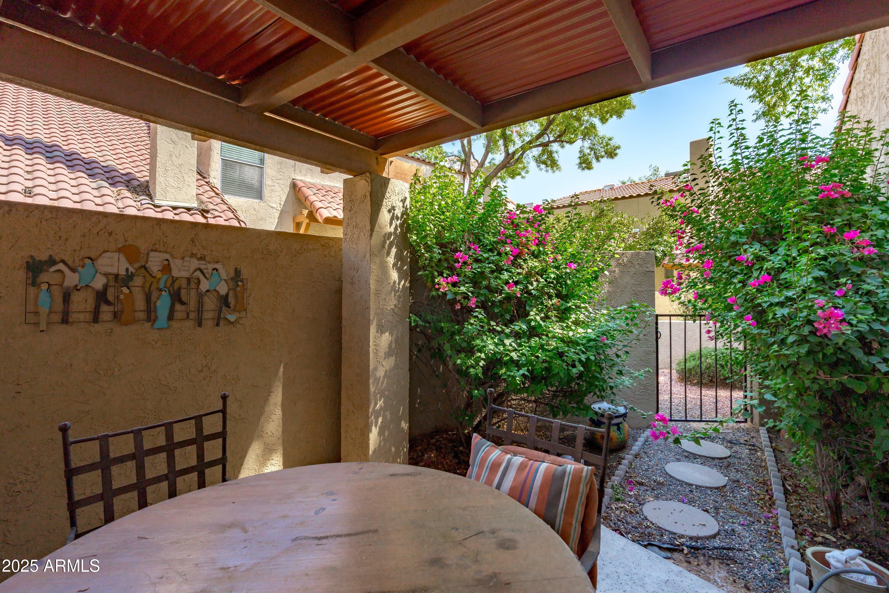 6533 North 7th Avenue, Unit 34 Phoenix, AZ 85013 - Photo 27 of 32 a backyard of a house with outdoor seating