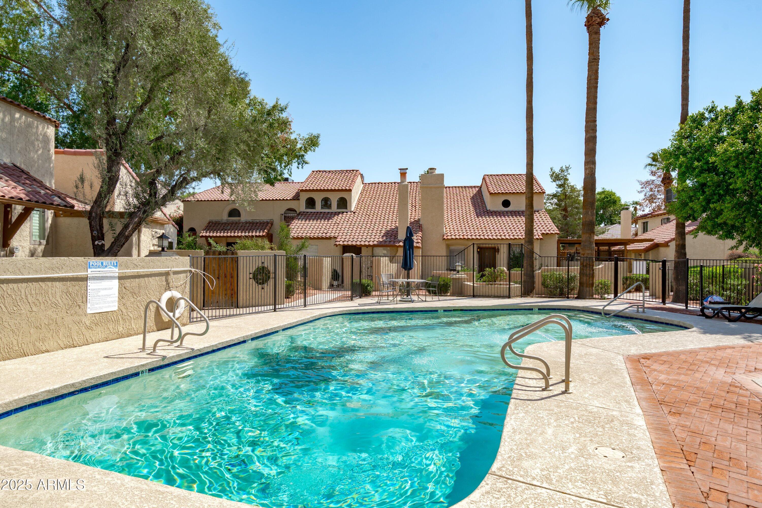 6533 North 7th Avenue, Unit 34 Phoenix, AZ 85013 - Photo 30 of 32 a view of a house with a big yard and a fountain