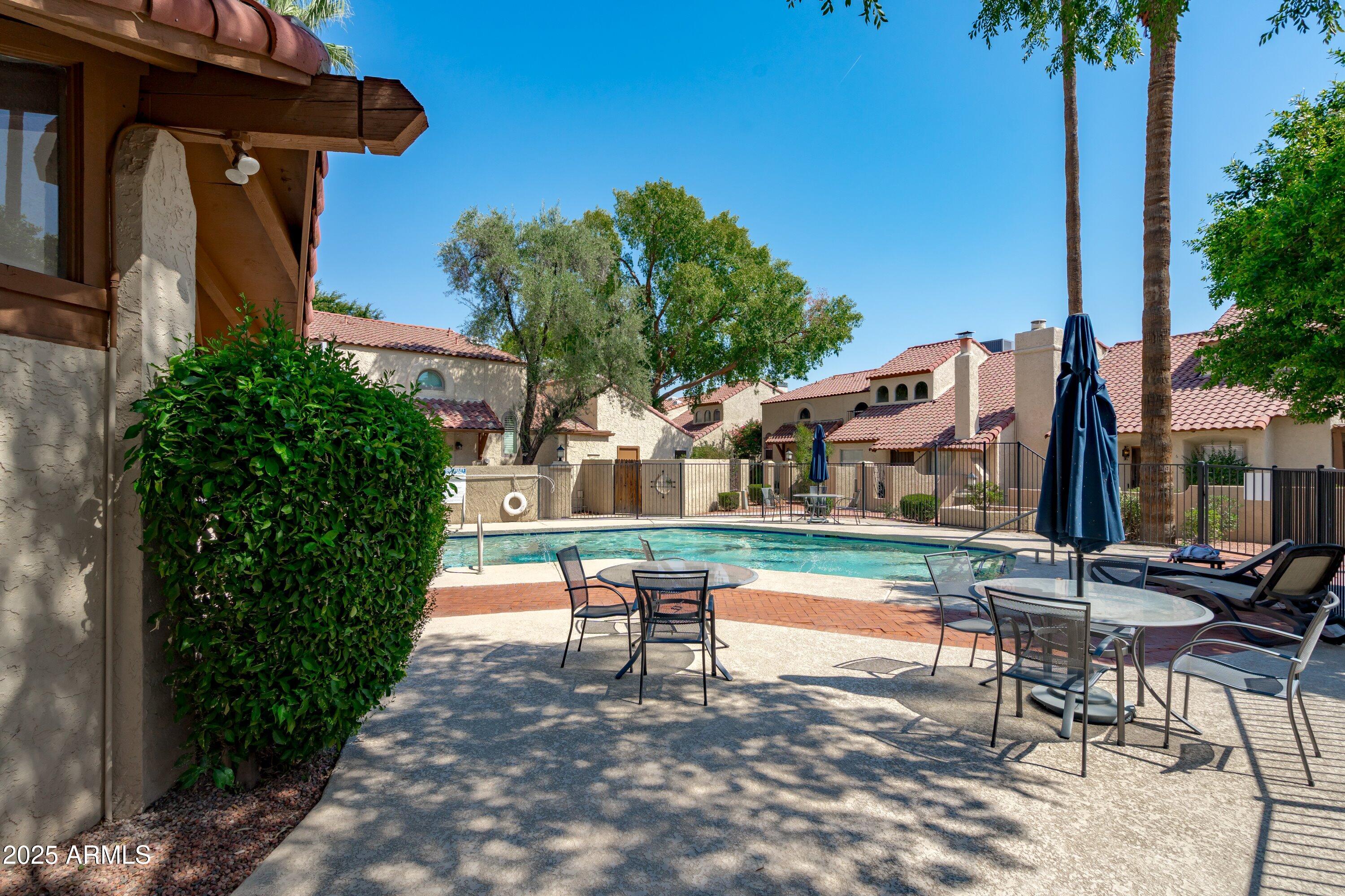 6533 North 7th Avenue, Unit 34 Phoenix, AZ 85013 - Photo 31 of 32 a swimming pool with outdoor seating and yard
