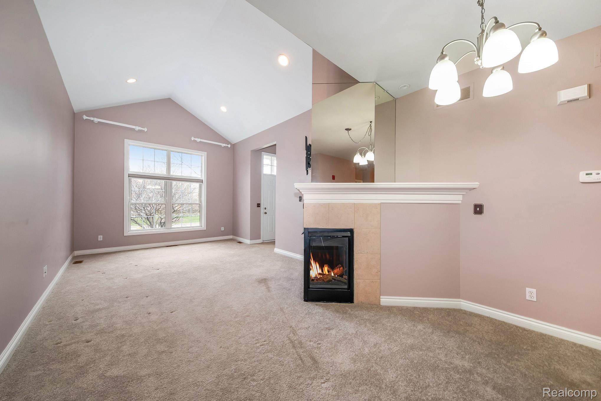 45751 North Stonewood Road Canton, MI 48187 - Photo 4 of 33 Living and Dining with double sided fireplace.