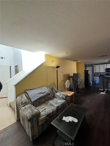 a living room with furniture and rug