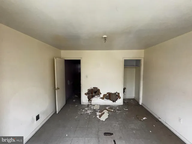 a white toilet sitting next to a shower