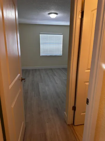 a view of an empty room with a window