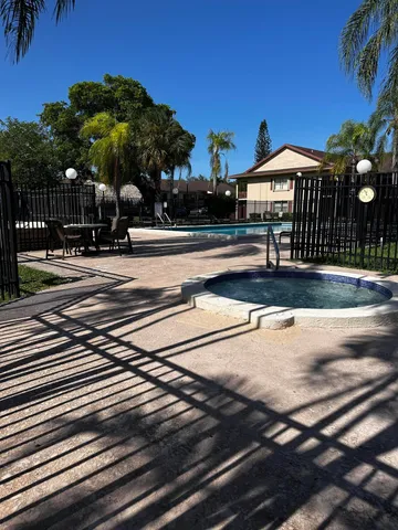 a view of a park with large trees