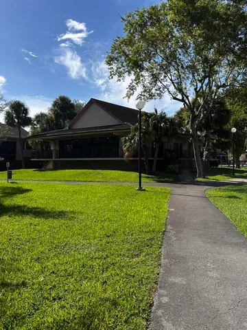 a view of a park with large trees
