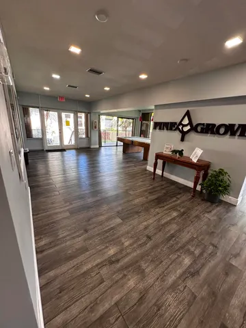a view of kitchen with stainless steel appliances a refrigerator and a stove top oven
