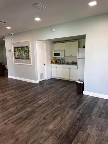 a spacious bathroom with a sink and a mirror
