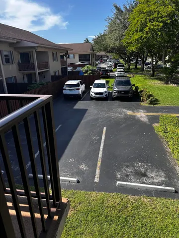 a view of street with parked cars