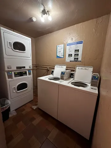 a room with furniture and a refrigerator