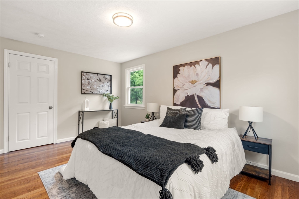 7 Prescott Road Sutton, MA 01588 - Photo 13 of 34 a bedroom with a bed and a painting on the wall