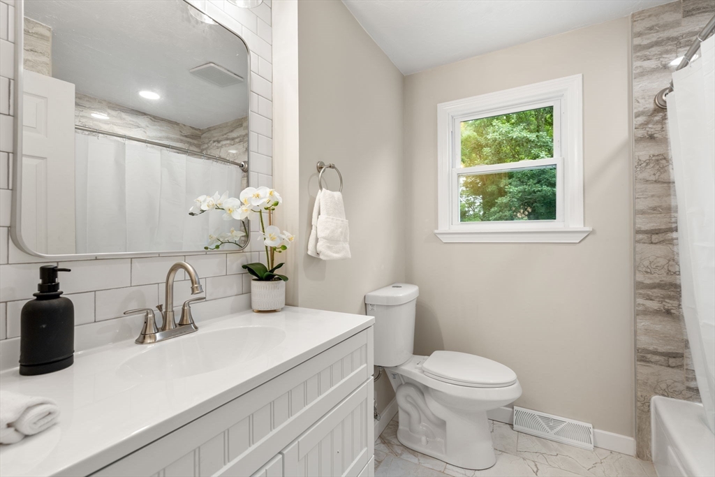 7 Prescott Road Sutton, MA 01588 - Photo 15 of 34 a bathroom with a sink toilet and a mirror
