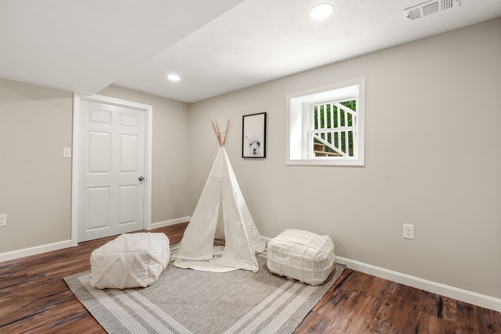 7 Prescott Road Sutton, MA 01588 - Photo 18 of 34 a room with a window and wooden floor