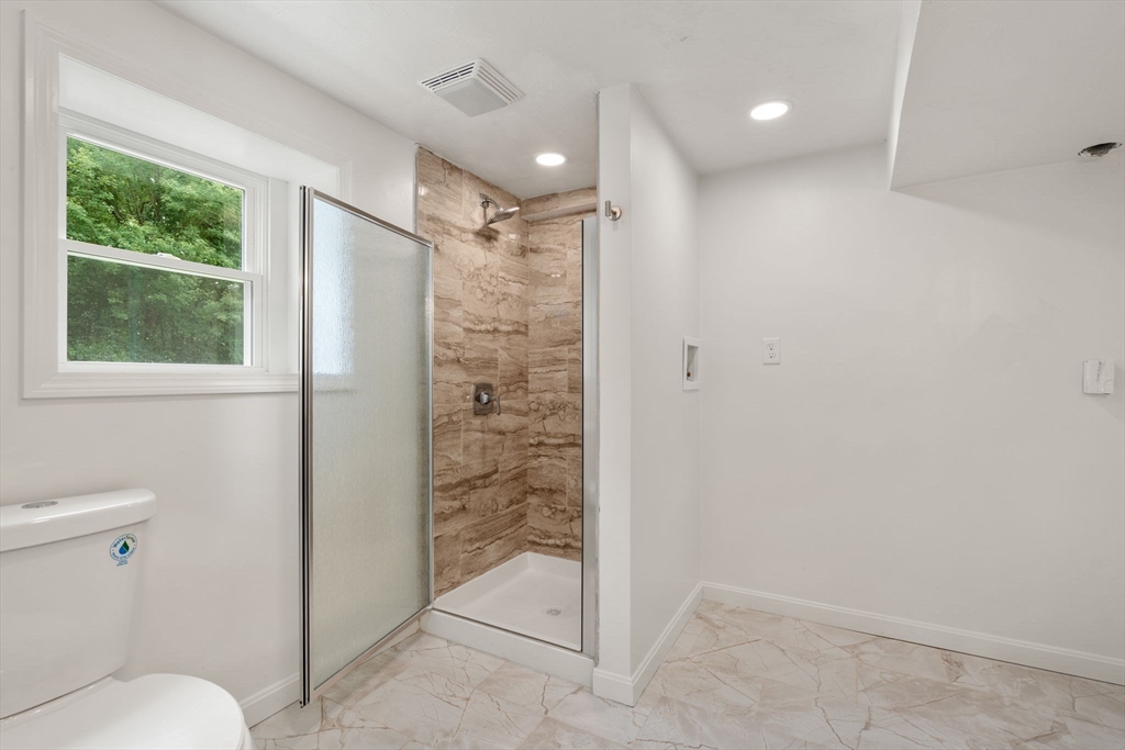 7 Prescott Road Sutton, MA 01588 - Photo 20 of 34 a bathroom with a shower and a toilet