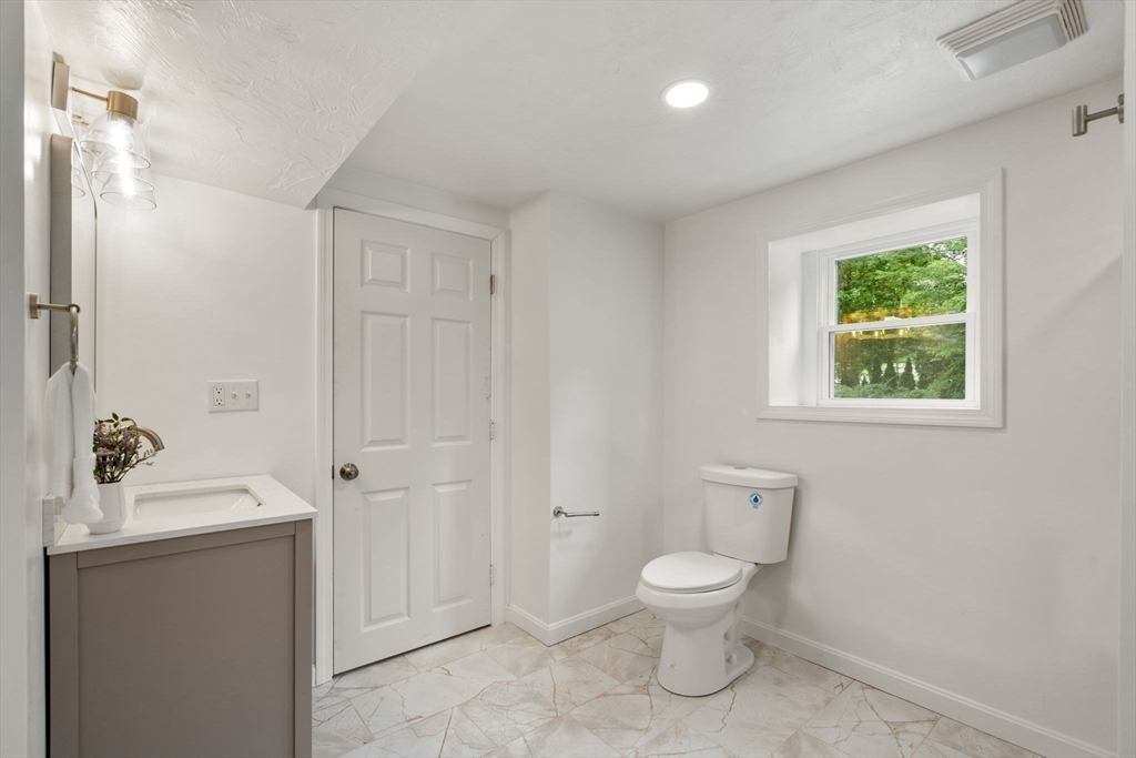 7 Prescott Road Sutton, MA 01588 - Photo 21 of 34 a bathroom with a toilet a sink and a mirror
