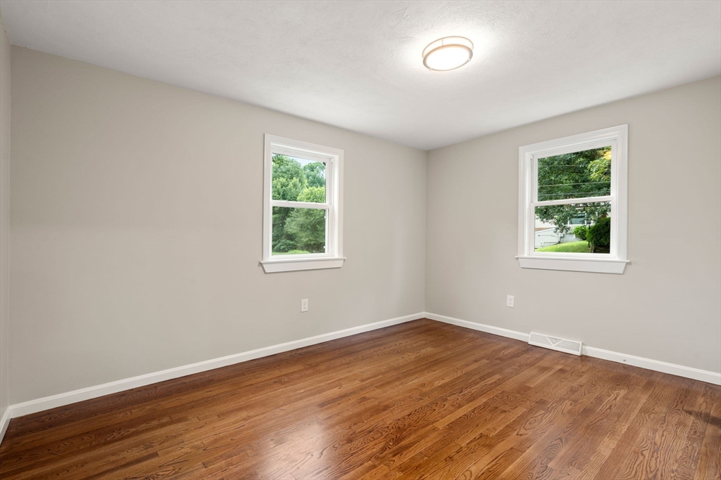 7 Prescott Road Sutton, MA 01588 - Photo 23 of 34 a view of a room with wooden floor and windows in it