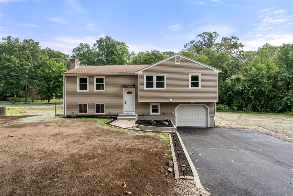 7 Prescott Road Sutton, MA 01588 - Photo 24 of 34 a house view with a garden space