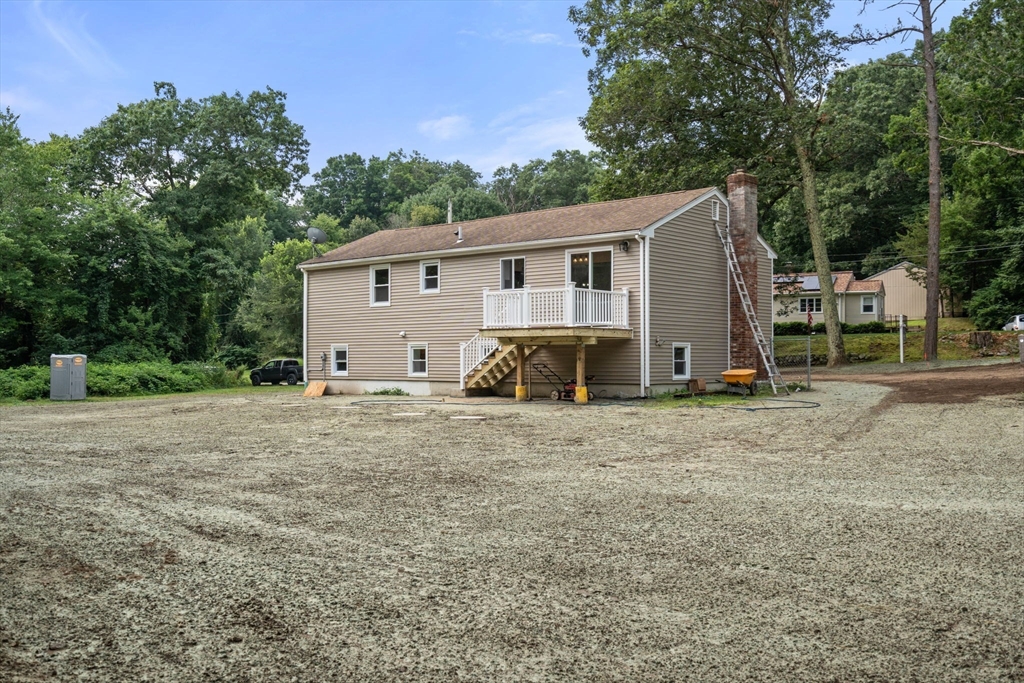 7 Prescott Road Sutton, MA 01588 - Photo 27 of 34 a view of a house with backyard and trees