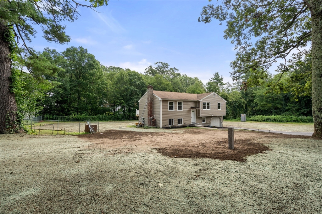 7 Prescott Road Sutton, MA 01588 - Photo 28 of 34 a house with trees in the background