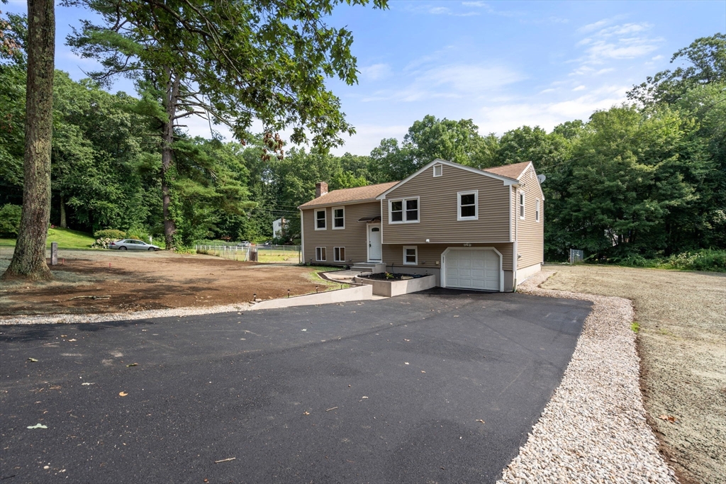 7 Prescott Road Sutton, MA 01588 - Photo 29 of 34 a front view of a house with a yard