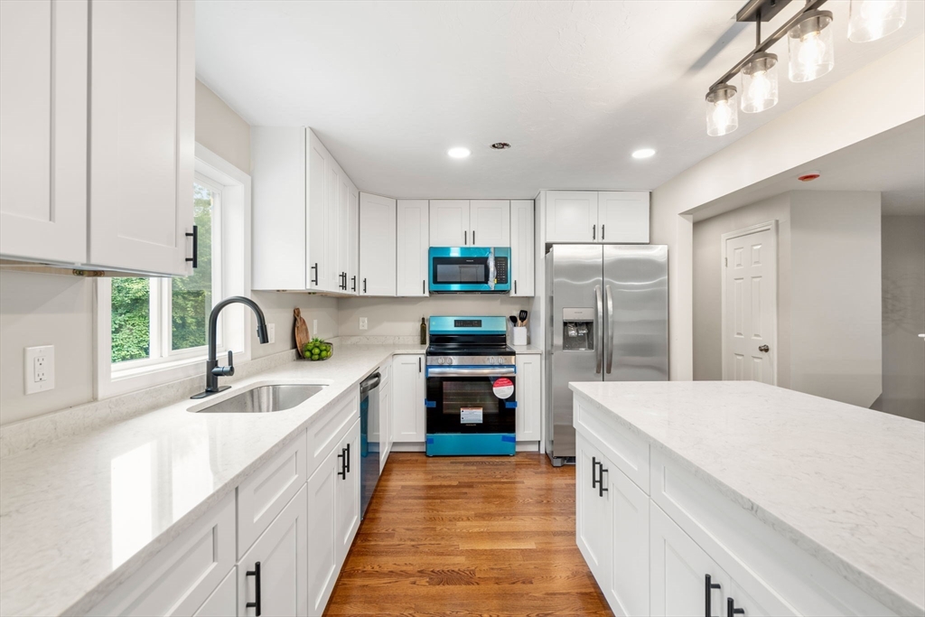 7 Prescott Road Sutton, MA 01588 - Photo 5 of 34 a kitchen with stainless steel appliances granite countertop a refrigerator sink and stove