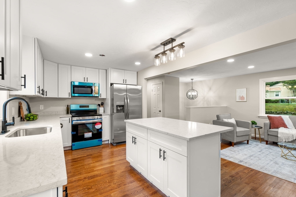 7 Prescott Road Sutton, MA 01588 - Photo 7 of 34 a kitchen with stainless steel appliances granite countertop a sink stove and refrigerator