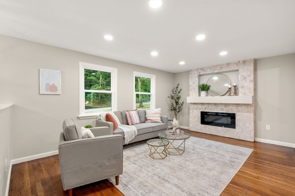 7 Prescott Road Sutton, MA 01588 - Photo 8 of 34 a living room with furniture and a fireplace