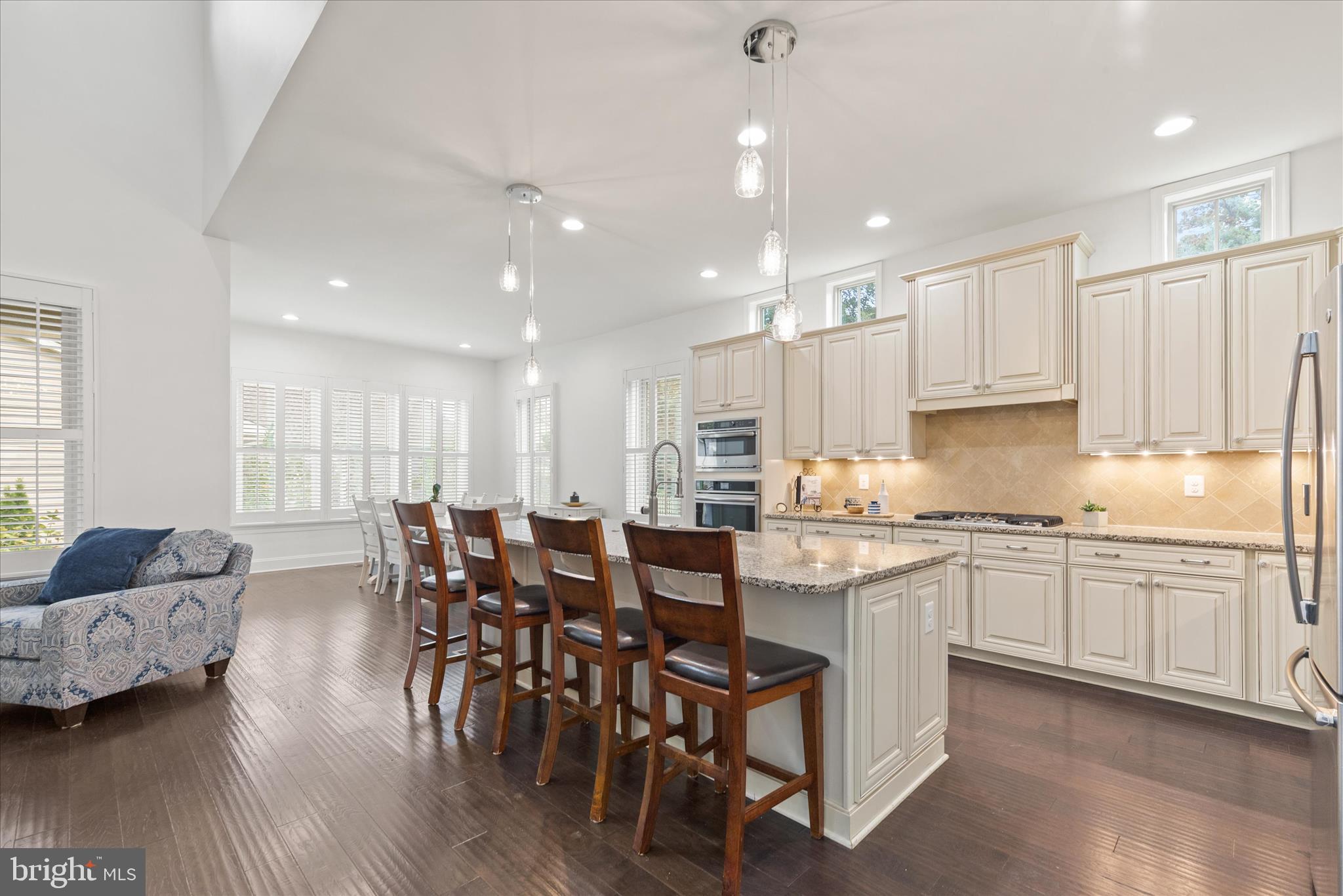 34749 Timber Court Dagsboro, DE 19939 - Photo 10 of 60 a large kitchen with kitchen island granite countertop lots of white cabinets appliances and furniture