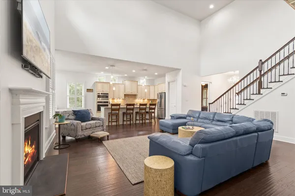 a bedroom with a bed and a dresser next to a window